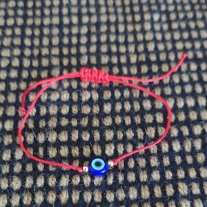 NWOT Adjustable Red String Bracelet with Blue Evil Eye Bead